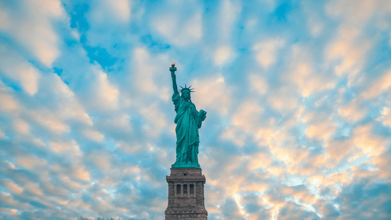 Statue of liberty surrounded by clouds